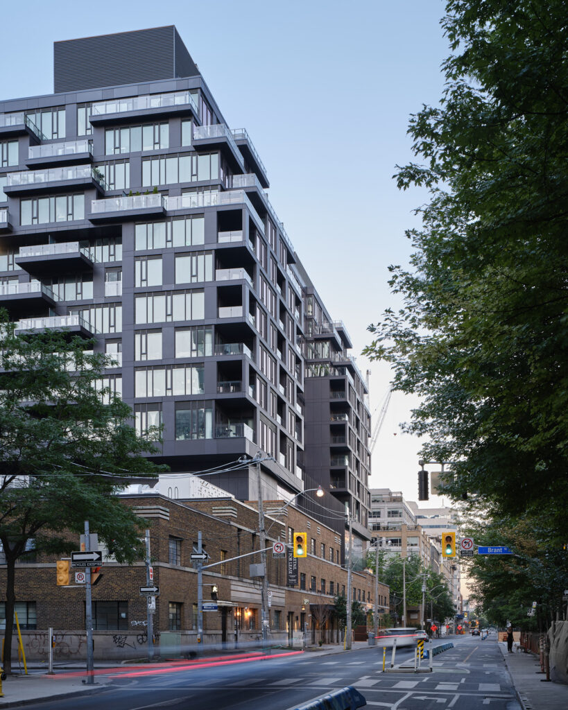 A street with cars and Waterworks Residences