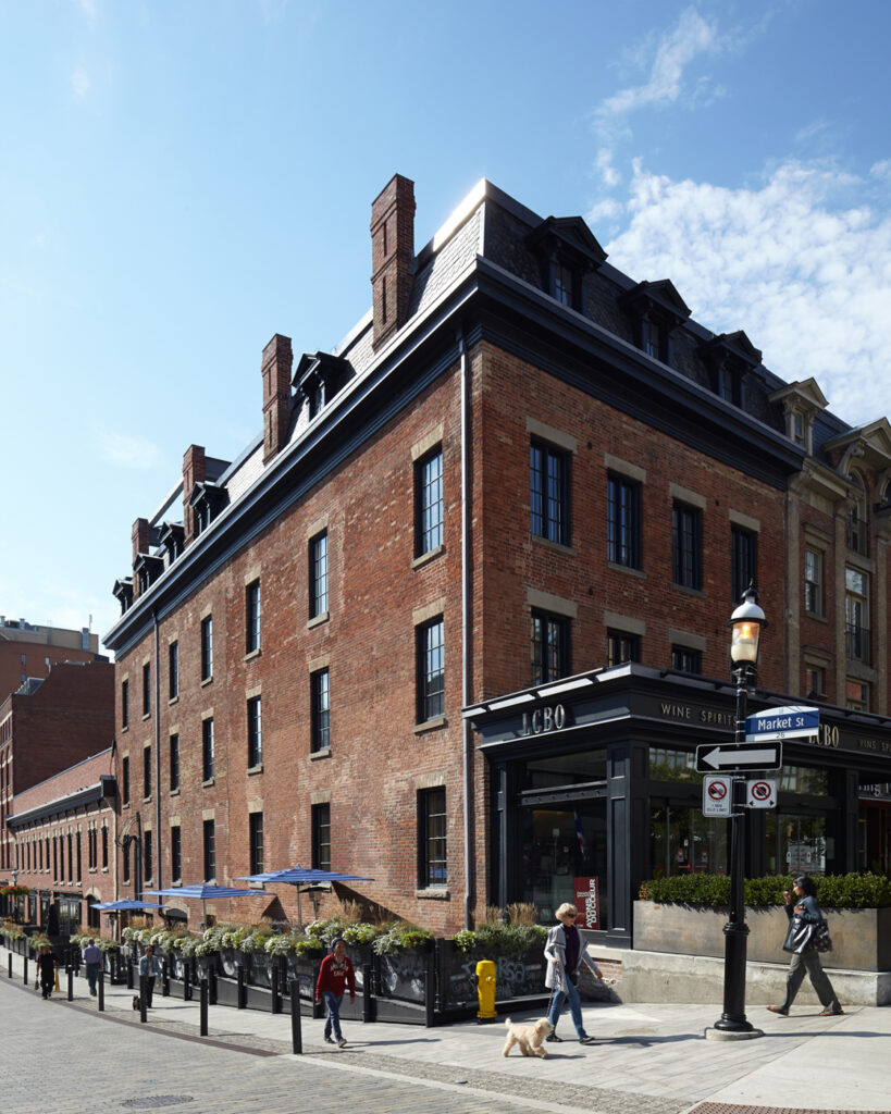 Market Street with people walking in front of it