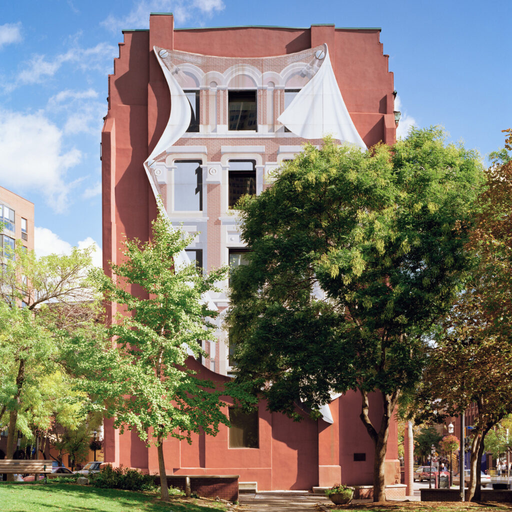 The side of the Gooderham Flatiron Building with trees