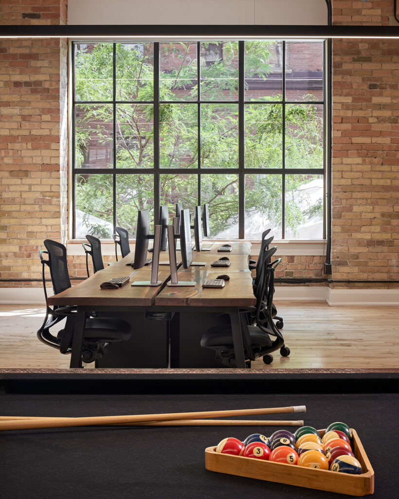 Woodcliffe office view showing work stations and pool table